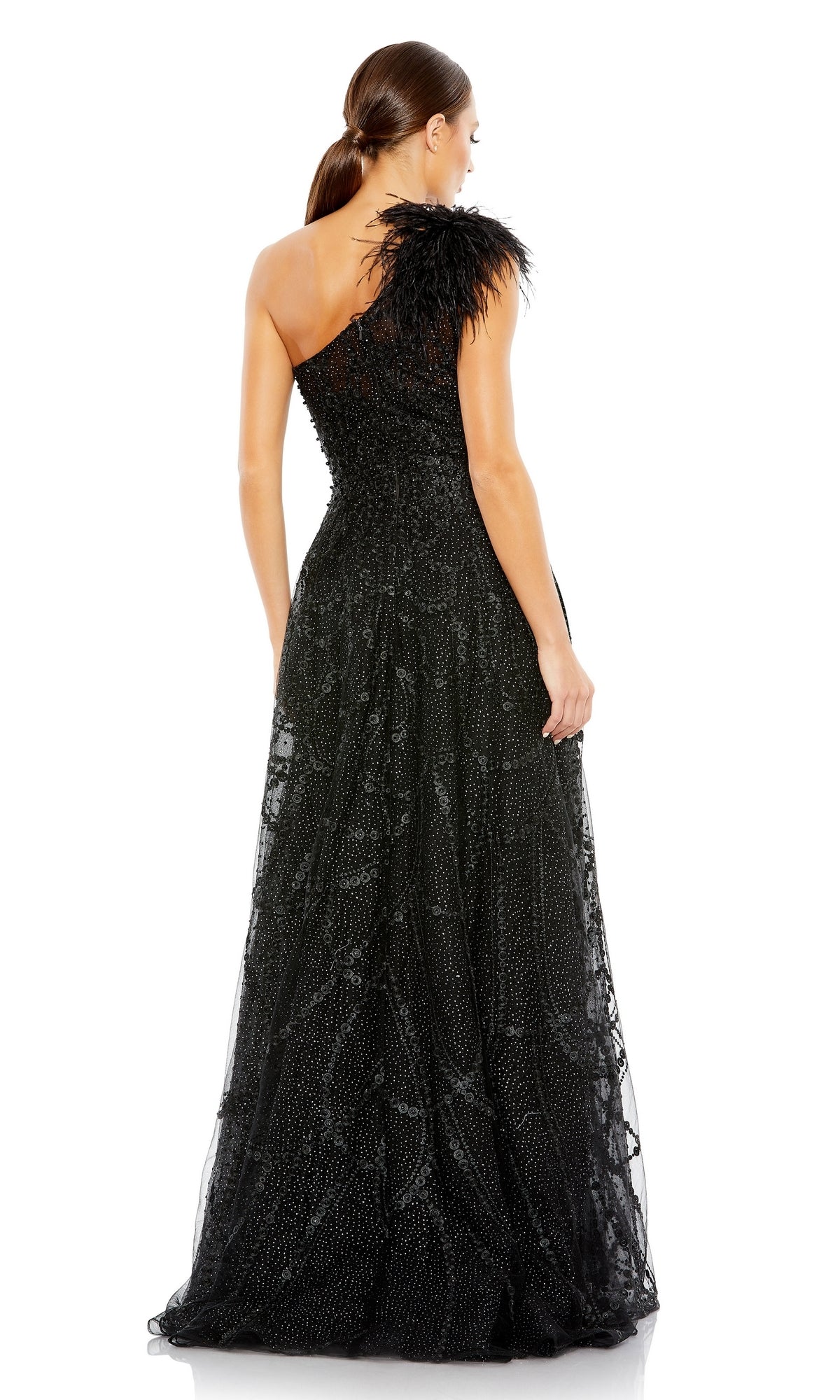 Woman in a black Mac Duggal 20389 beaded one-shoulder prom gown with feathered detailing, shown from the back against a white background.